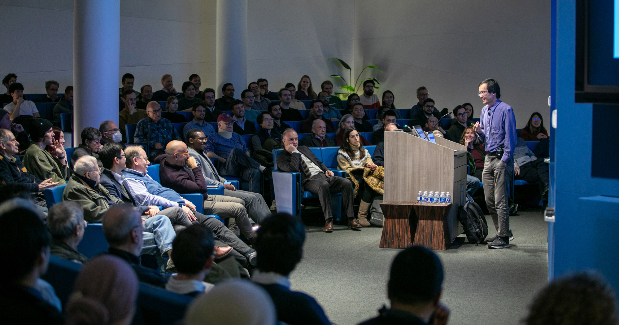 Photo of Terence Tao giving a Presidential Lecture in February 2025 to an engaged audience at the Simons Foundation.